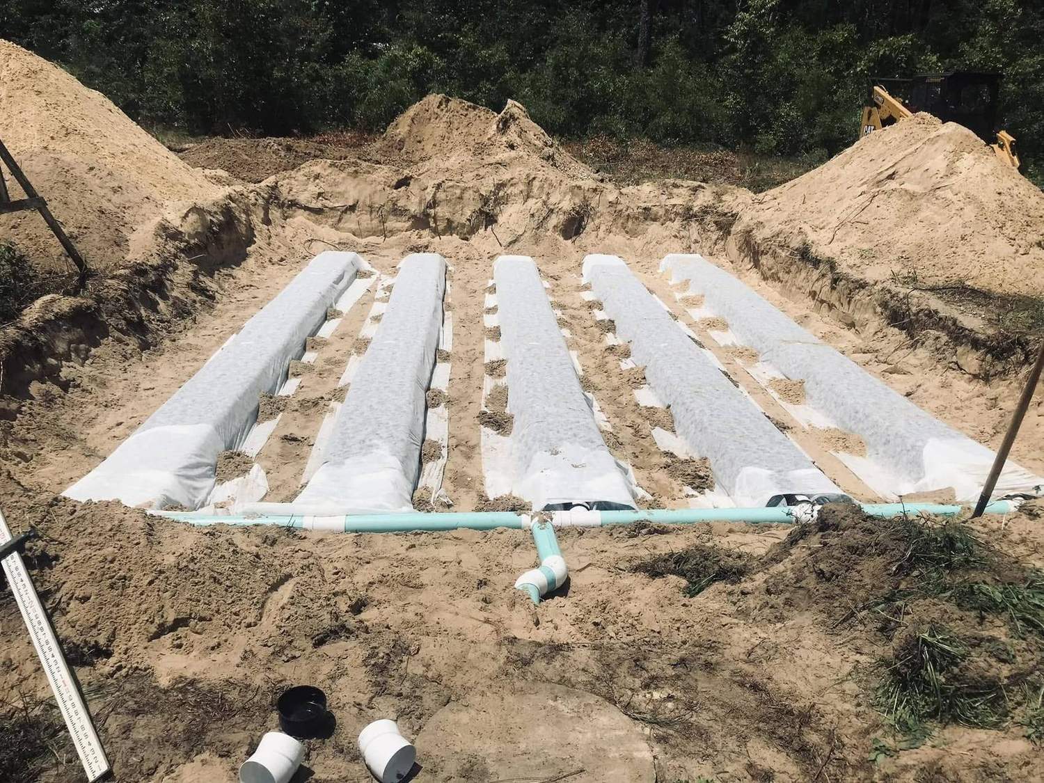 A Gator Well & Septic drain field installation under way.